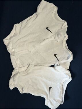 Nike White Infant One-Piece Bodysuits with Black Swoosh - 3 Pack
